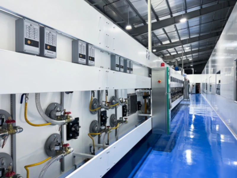 Factors affecting baking oven efficiency in biscuit production, showing tunnel oven interior with conveyor and heat zones for RTO integration.